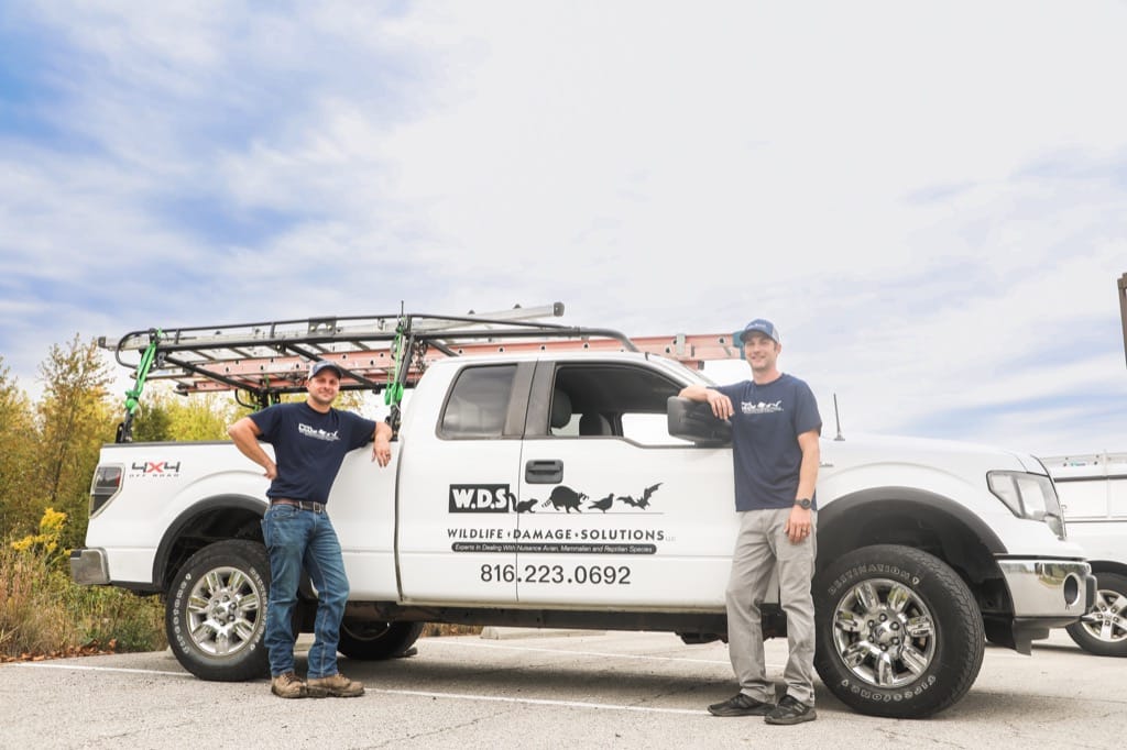 Wildlife Damage Solutions Team In Front Of Their Truck